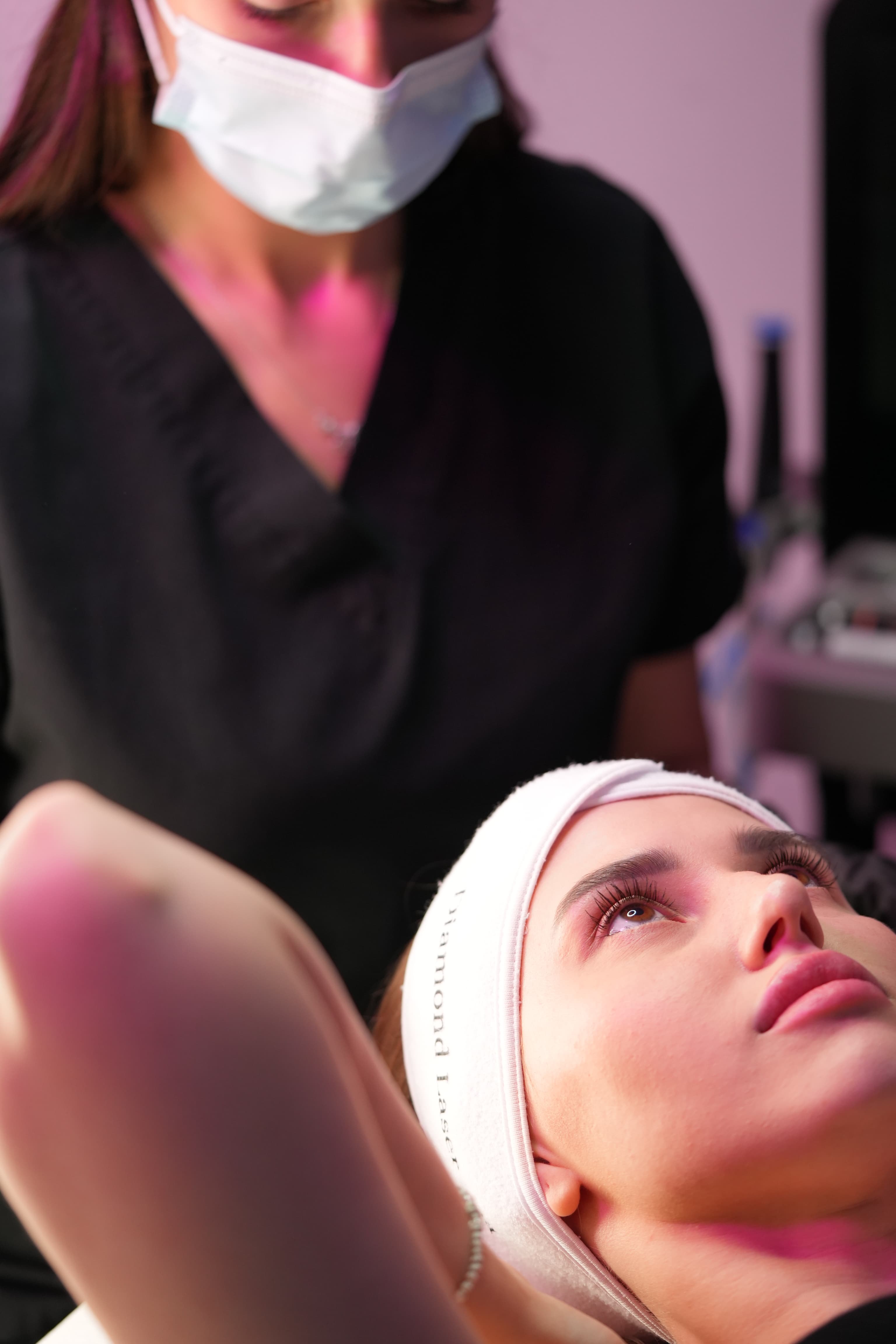 Specialist performing skin treatment